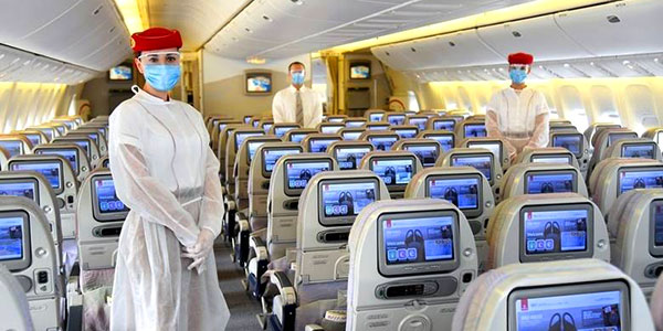 Emirates crew in their PPE uniforms and masks for flights during the Covid-19 phase