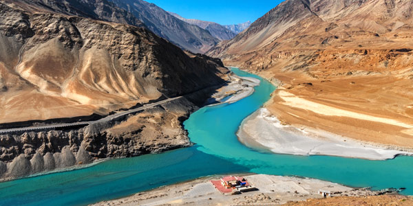 Zanskar winter trek guide - the confluence of the muddy Indus with the turquoise blue waters of the Zanskar River