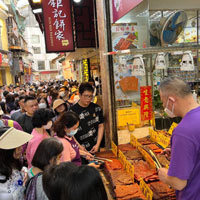 Macau alleys are packed with tourists