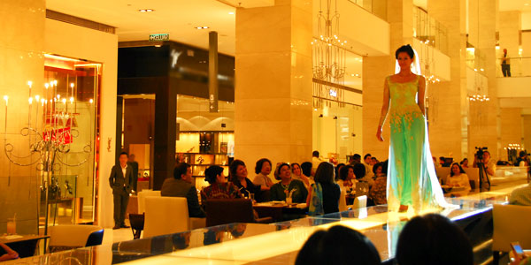 Kuala Lumpur shopping guide and mega-sale tips, model strolls the catwalk at Pavilion Mall
