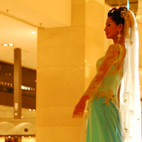 Model on catwalk at Pavilion Mall, a high end Kuala Lumpur shopping escape
