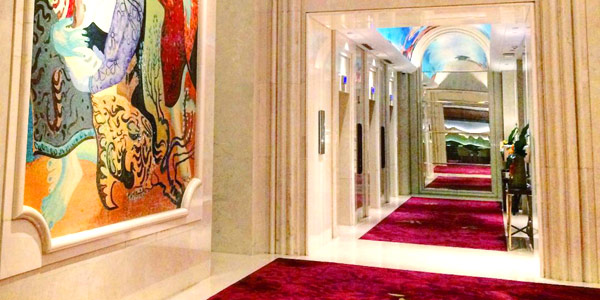 Rafrfles Jakarta offers a marble museum of a lobby with stunning murals