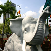 Saigon fun dining, elephants gambol on the Rex rooftop where big buffets are served