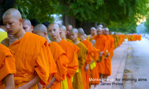Monks line up for morning aims / photo: James Philips