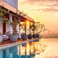 Sunset over pool at Jetwing Colombo Seven