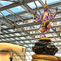 Bangkok duty free shopping at Suvarnabhumi Airport is dominated by a giant heritage statue
